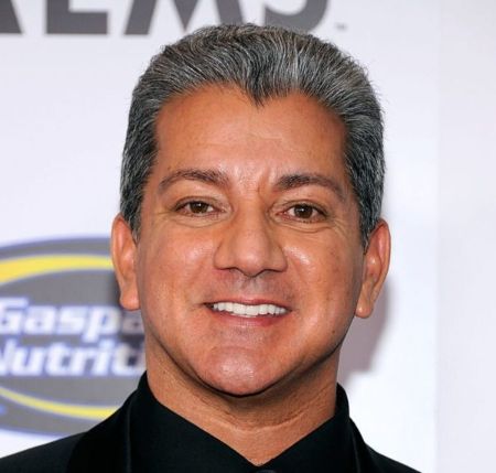 Bruce Buffer poses a picture at an event.